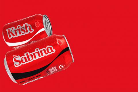 Two Coca-Cola cans on a red background