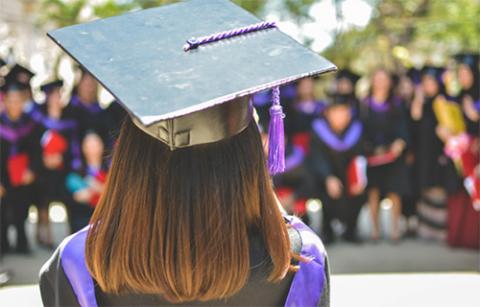 Graduate facing a crowd