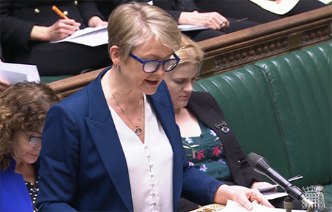Yvette Cooper (a woman with short hair and glasses) speaking in Parliament