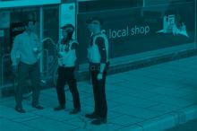 Police officers outside a shop