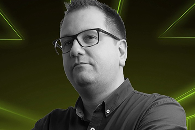 Man with arms crossed in green background